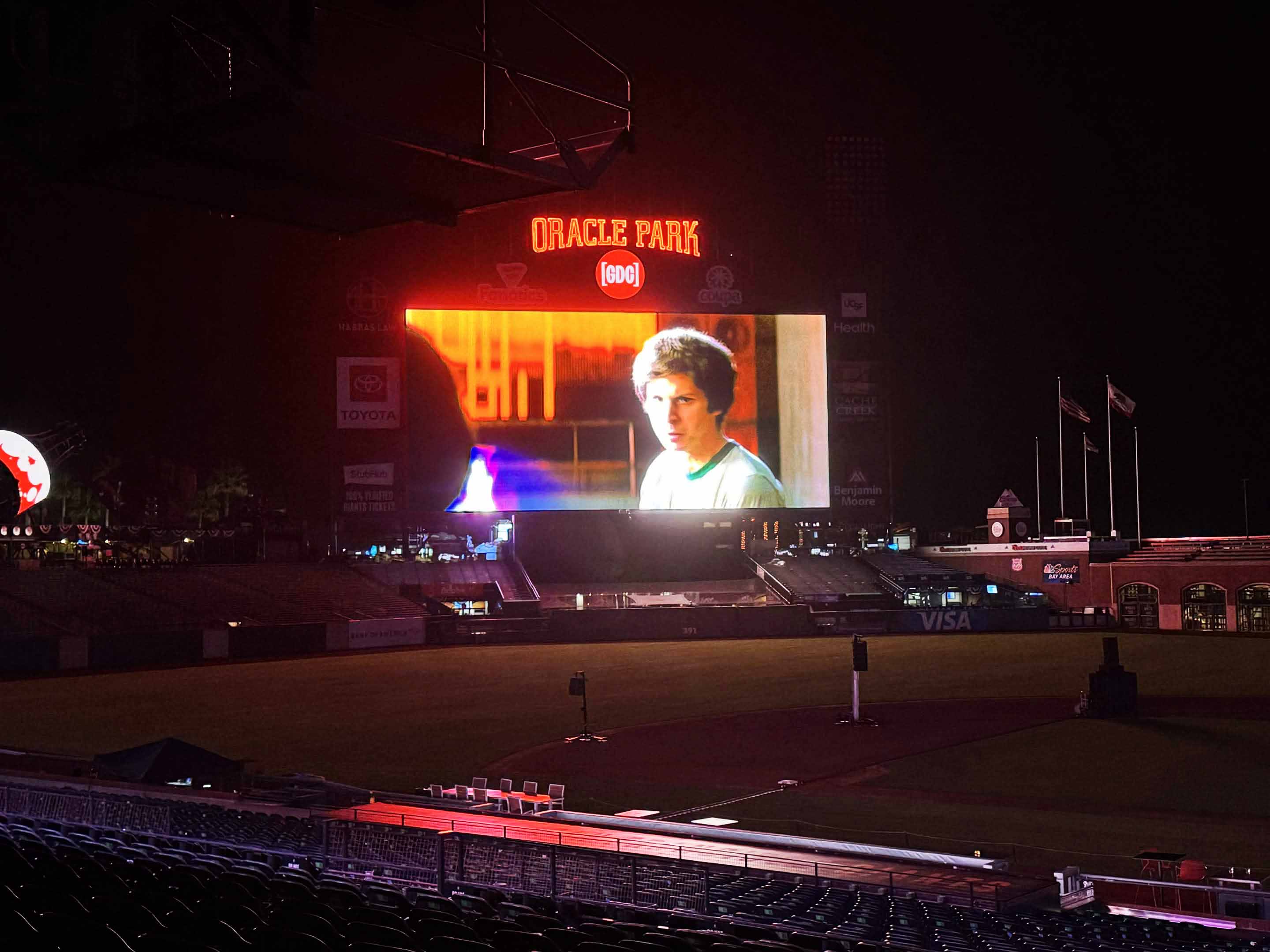 Photo of film playing at night at Oracle baseball park